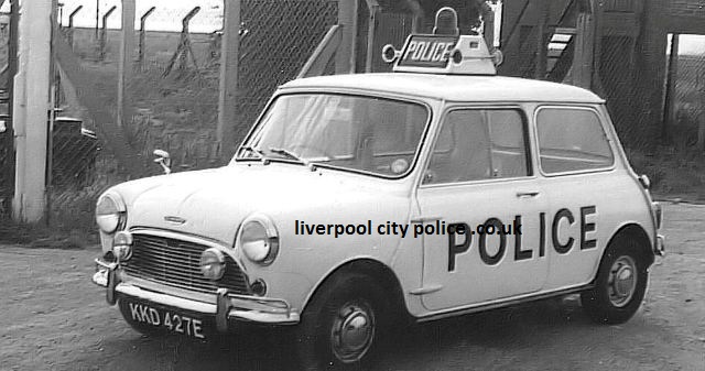 Austin Mini Cooper S MkI KKD 427E in police service, with POLICE lettering, roof-mounted air horns and additional front lamps