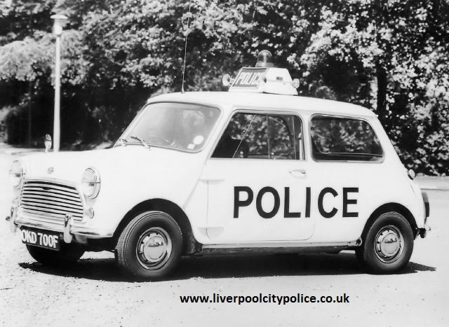 Morris Mini Cooper S MkII OKD 700F showing its side POLICE lettering, roof-mounted POLICE sign, beacon and radio aerial.